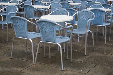 tables and chairs outdoor cafe in Piazza San Marco, Italy