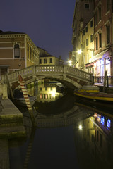 Fototapeta na wymiar Old Rainy Venice Street and Channels at night