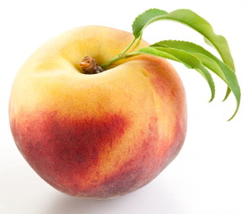 Ripe peach with leaves