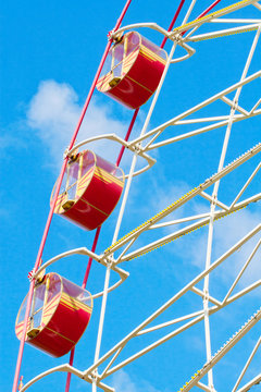 Big dipper carousel against blue sky