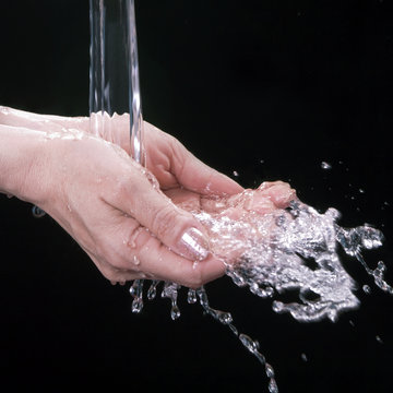 Water flows in female palms (a black background)