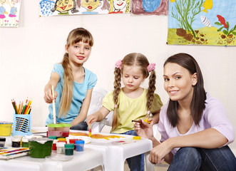 Child painting in preschool.