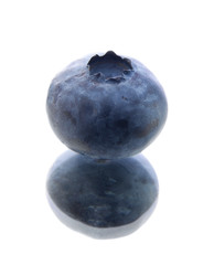 single blueberry on mirror