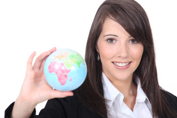 woman holding out world globe