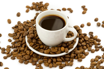 Coffee beans with small coffee cup
