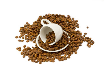 Coffee beans with small coffee cup