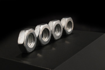 Four nuts in row aligned well