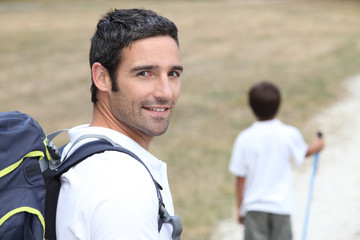 Fototapeta premium Dad hiking with son