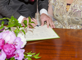 Groom Signing the Wedding Registrar