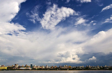 Fototapeta na wymiar Sky with storm clouds over the port city.City Quay