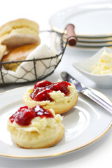 scone with strawberry jam and clotted cream , afternoon tea
