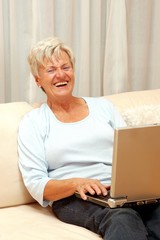 Happy chatting senior woman