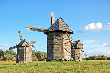 Fototapeta na wymiar Antique ramshackle wooden windmill, Pirogovo, Kiev, Ukraine