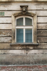 Window on old stylish facade wall