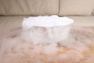 smoke of dry ice on table