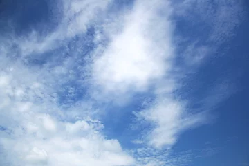 Raamstickers blue sky with beautiful white clouds © jahmaica