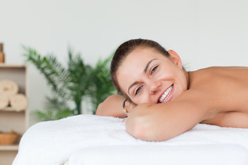 Obraz na płótnie Canvas Smiling brunette waiting for a massage