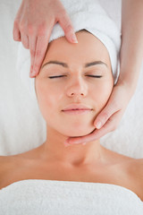 Fototapeta na wymiar Portrait of a woman enjoying a facial massage