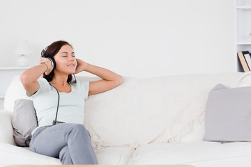 Good looking brunette listening to music