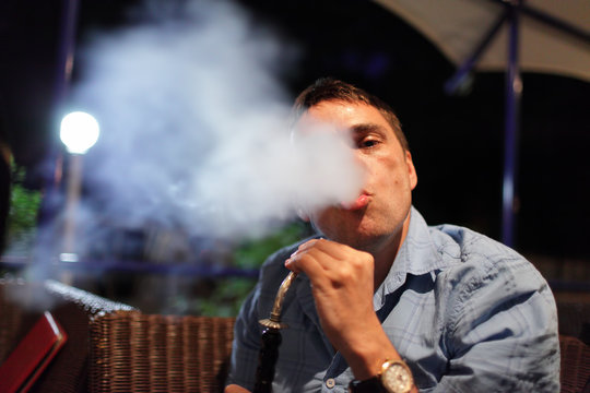 Man smokes shisha