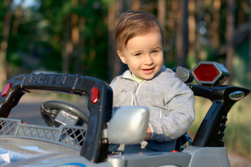 Baby in a toy car