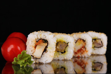 sushi rolls isolated on black