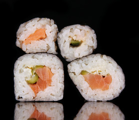 sushi rolls isolated on black