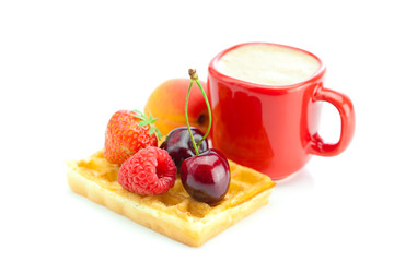 cappuccino cup, waffles,apricot, cherries, strawberries and rasp