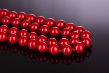 red pearls on black background