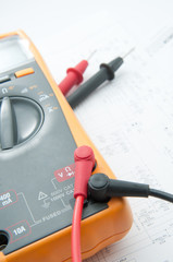 Multimeter lay down the white circuit paper