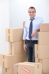 Man surrounded by boxes
