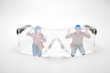 Man and woman stuck behind giant protective goggles