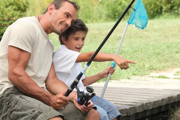 Fotobehang father and son fishing © auremar