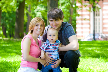 Young parents and baby for a walk