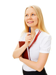 Pensive businesswoman with book and pen