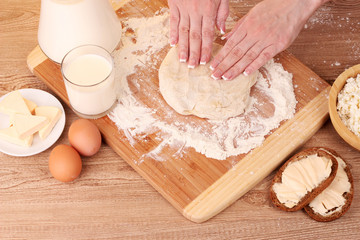 preparation of dough on wooden background