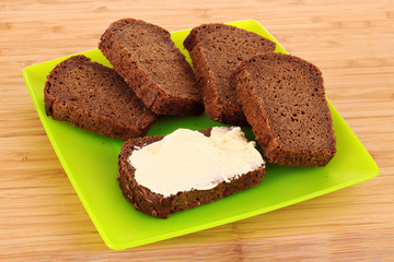 delicious sandwiches on plate on wooden background