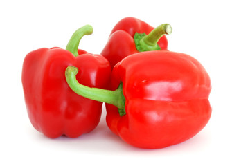 Three red bell peppers isolated on white background