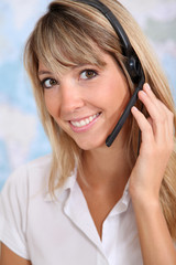 Portrait of smiling teleoperator with headset