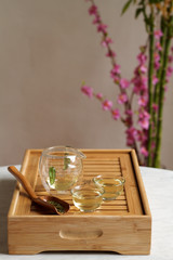 Chinese tea set with wooden scoop filled with tea leave