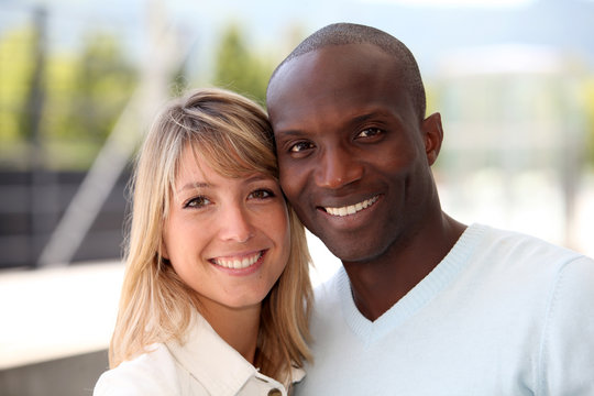Portrait of happy mixed couple
