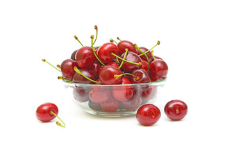 ripe cherry in a glass bowl on a white background