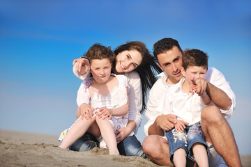 happy young family have fun on beach