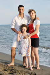 Fototapeta premium happy young family have fun on beach