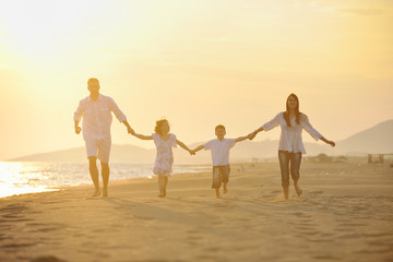happy young family have fun on beach