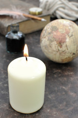 Fototapeta na wymiar Vintage globe and candle