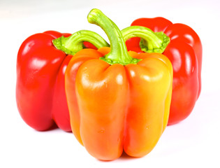 Orange and red pepper isolated on white