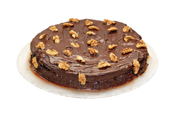 Chocolate cream cake on plate, isolated on white background