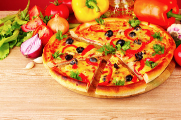 pizza and vegetables on a red background