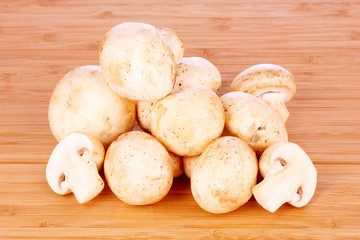 Champignon on wooden background